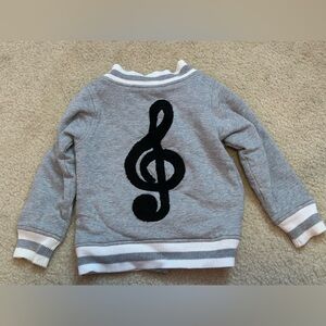 Monica and Andy Gray Cardigan with Black Treble Clef Design